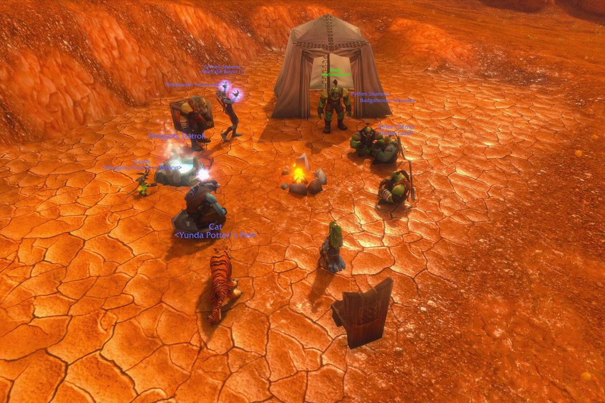 A camp in WoW Forever: a campfire with a tent, a camp chair and players sitting around it